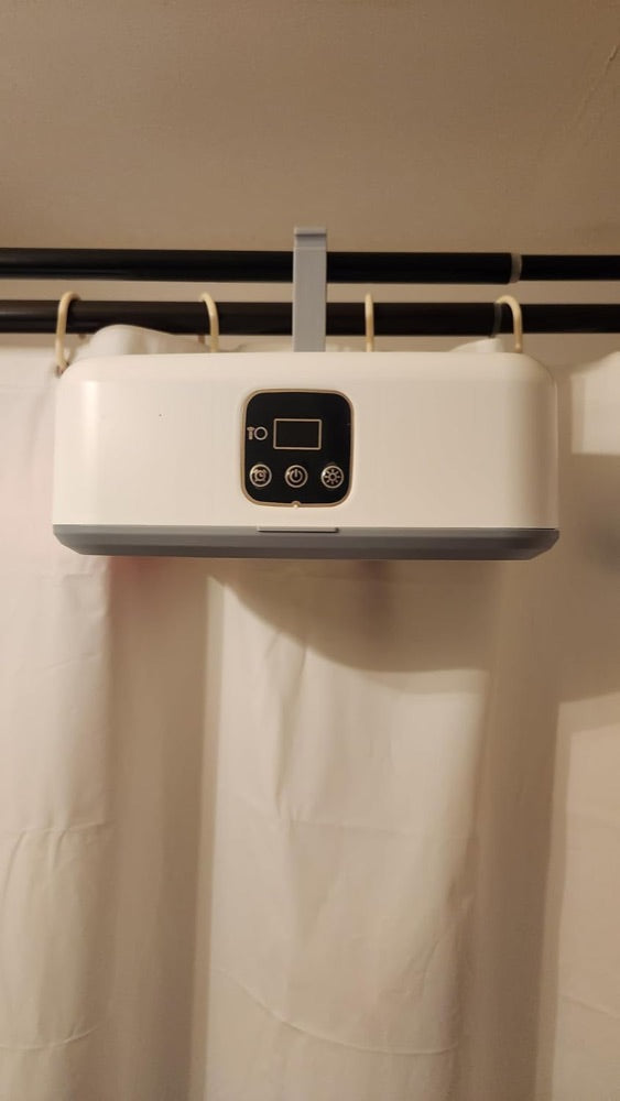 Customer photo: close view of the unit hooked over a shower rail