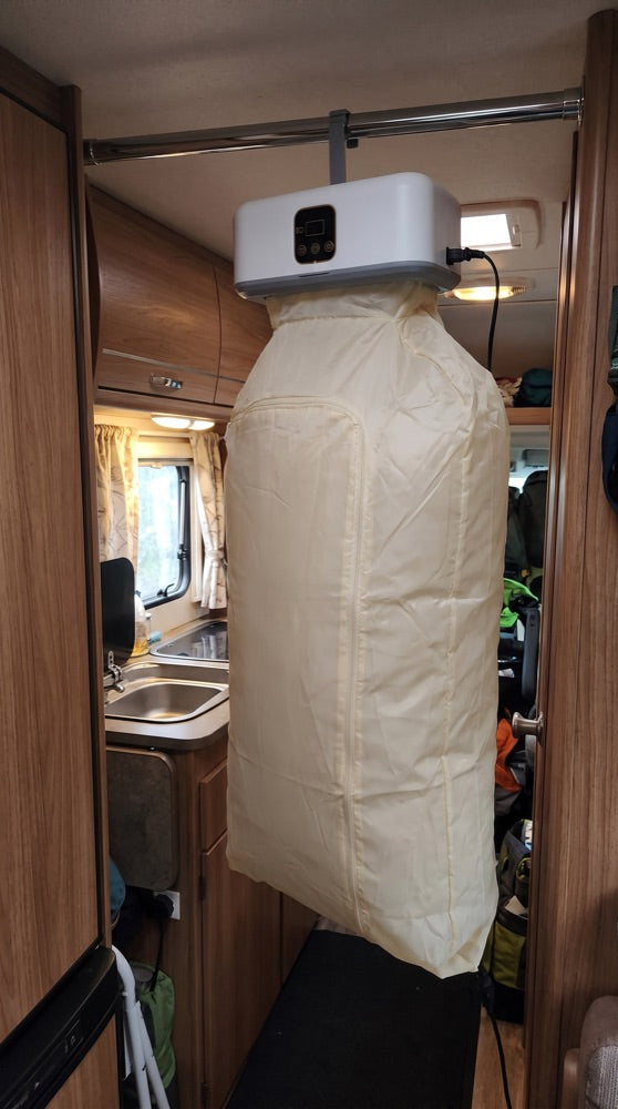 The dryer hung from a rail inside a camper van