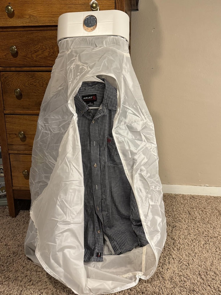 Customer photo: the cover unzipped with a checked shirt hanging inside