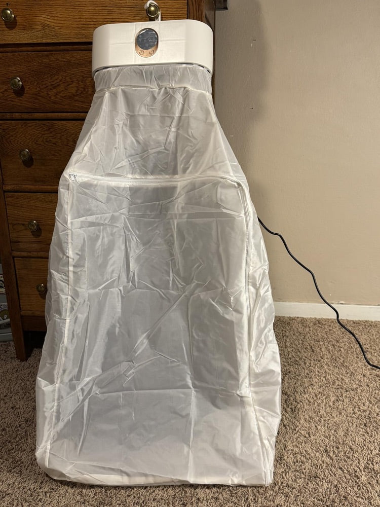 Customer photo: the cover zipped shut and running, hooked over a dresser